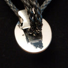 A close-up of the back displaying a Sterling Silver stamp.