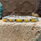 Sterling silver link bracelet with bumblebee jasper set in geometric bezels.