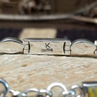 Close-up of the artisan's stamped initial.