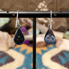 Handcrafted Navajo sterling silver teardrop earrings featuring vibrant Bumblebee Jasper cabochons with golden-yellow tones, natural earthy inclusions, and twisted rope border detailing; artisan and Sterling Silver stamp.