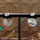 Close-up of the artisan's stamped initial.