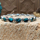 Sterling silver link bracelet with Chinese turquoise set in oval bezels.