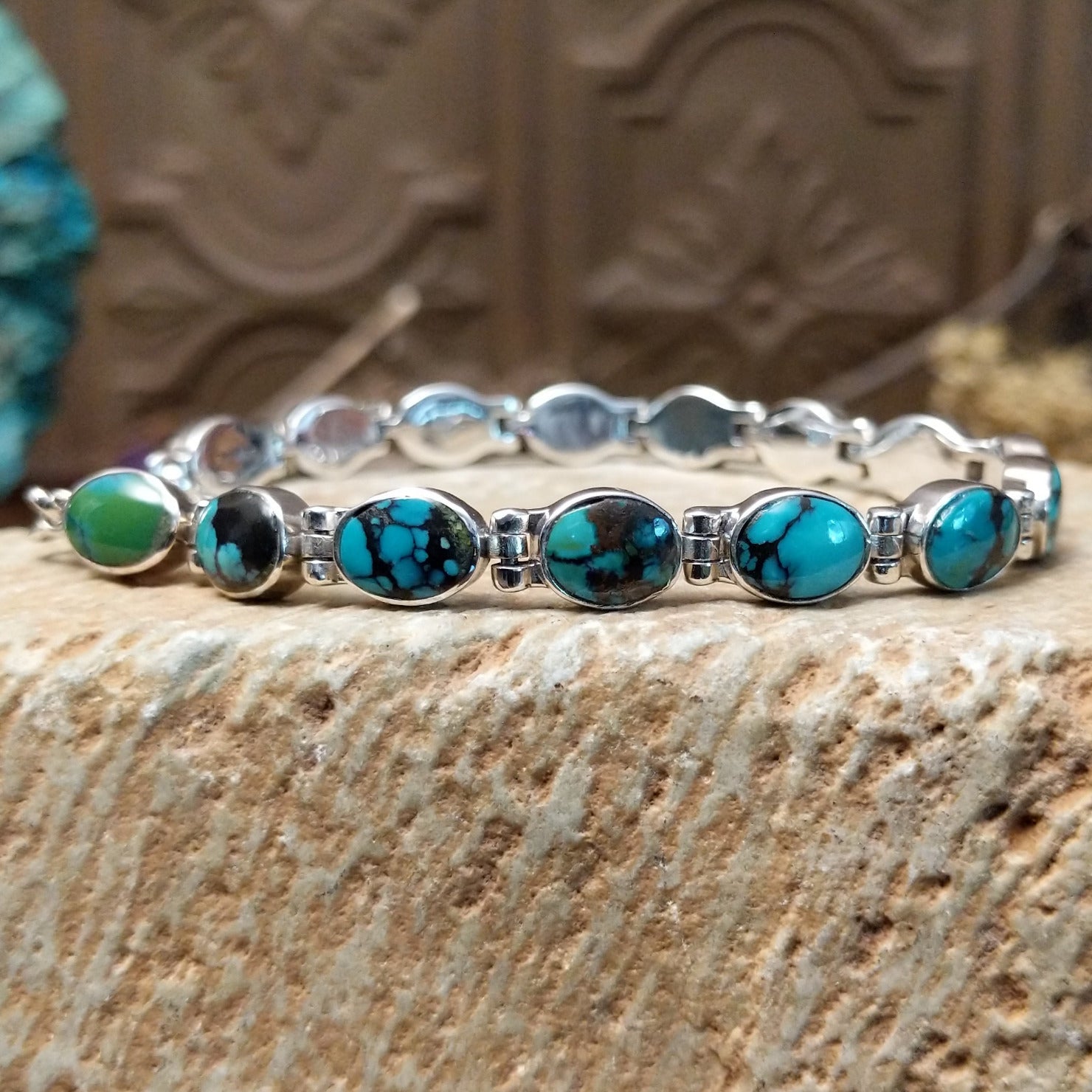 Sterling silver link bracelet with Chinese turquoise set in oval bezels.