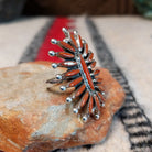 Navajo silver ring with radiating coral stones and silver drops.
