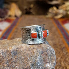 Sterling silver ring with coral set in square bezels.