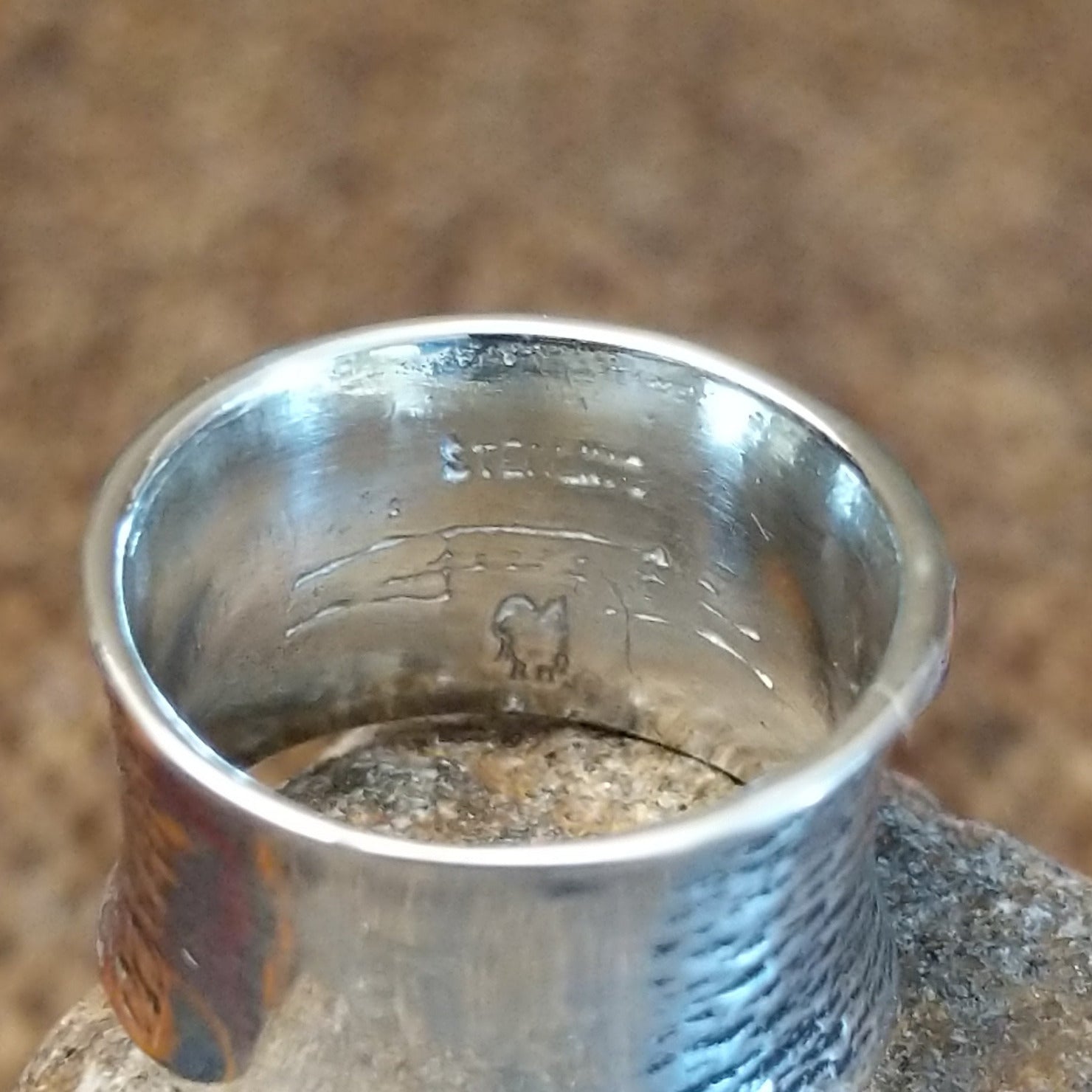 Close-up of the sterling silver stamp.