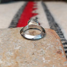 Navajo silver ring with lapis stone and ornate crown-style setting.