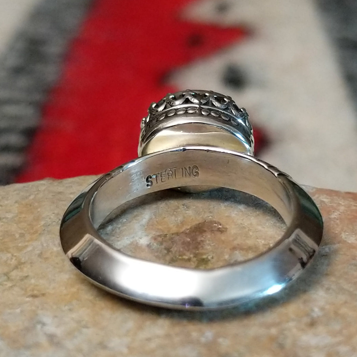 Stamped ring composition, signifying sterling silver construction
