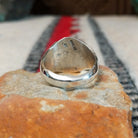 Navajo turquoise ring by S. with graduated silver drop accents.