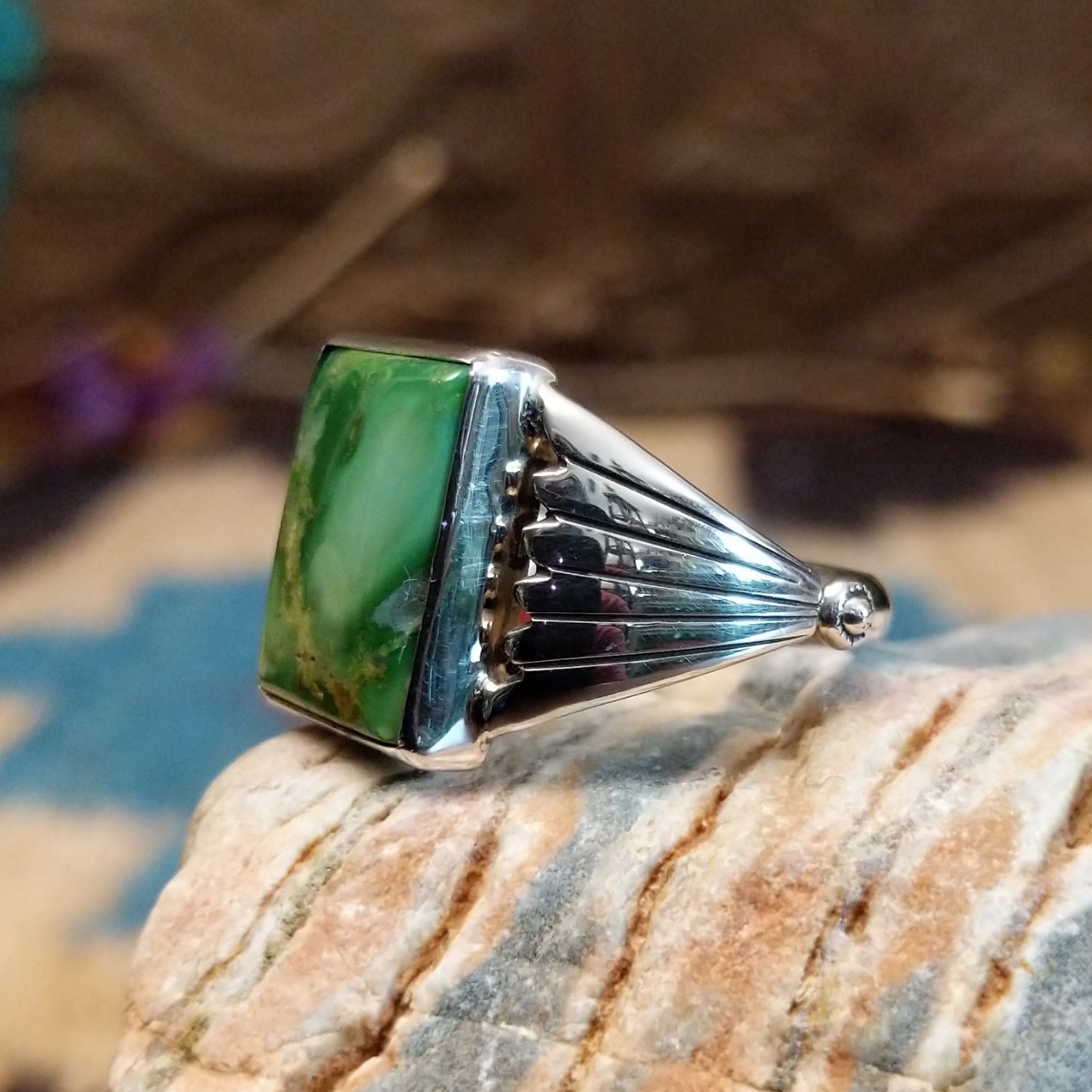 Sterling silver ring with Sonoran gold turquoise set in a square bezel and draped band.