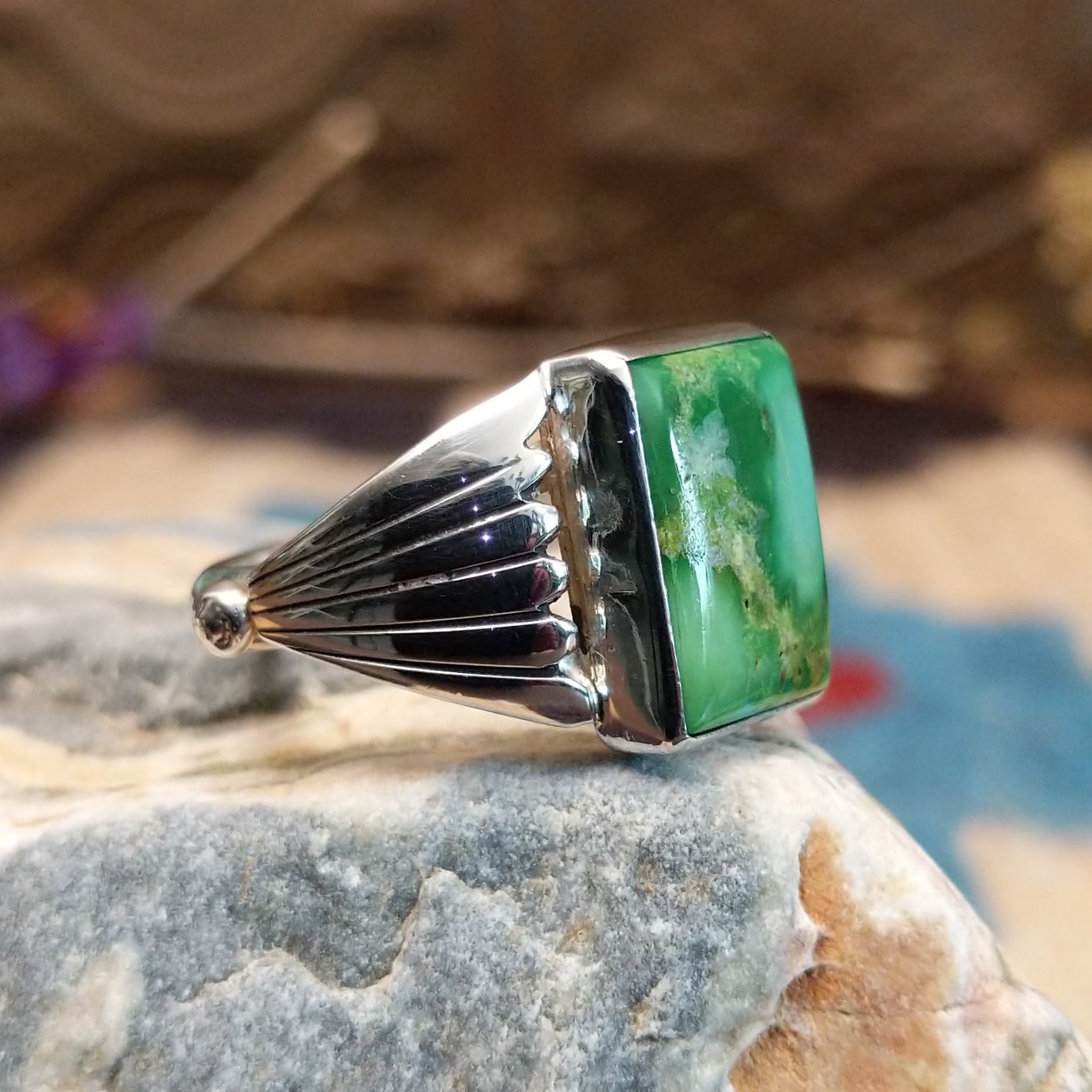 Sterling silver ring with Sonoran gold turquoise set in a square bezel and draped band.