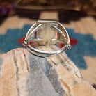Sterling silver ring with Sonoran gold turquoise set in a square bezel and draped band.