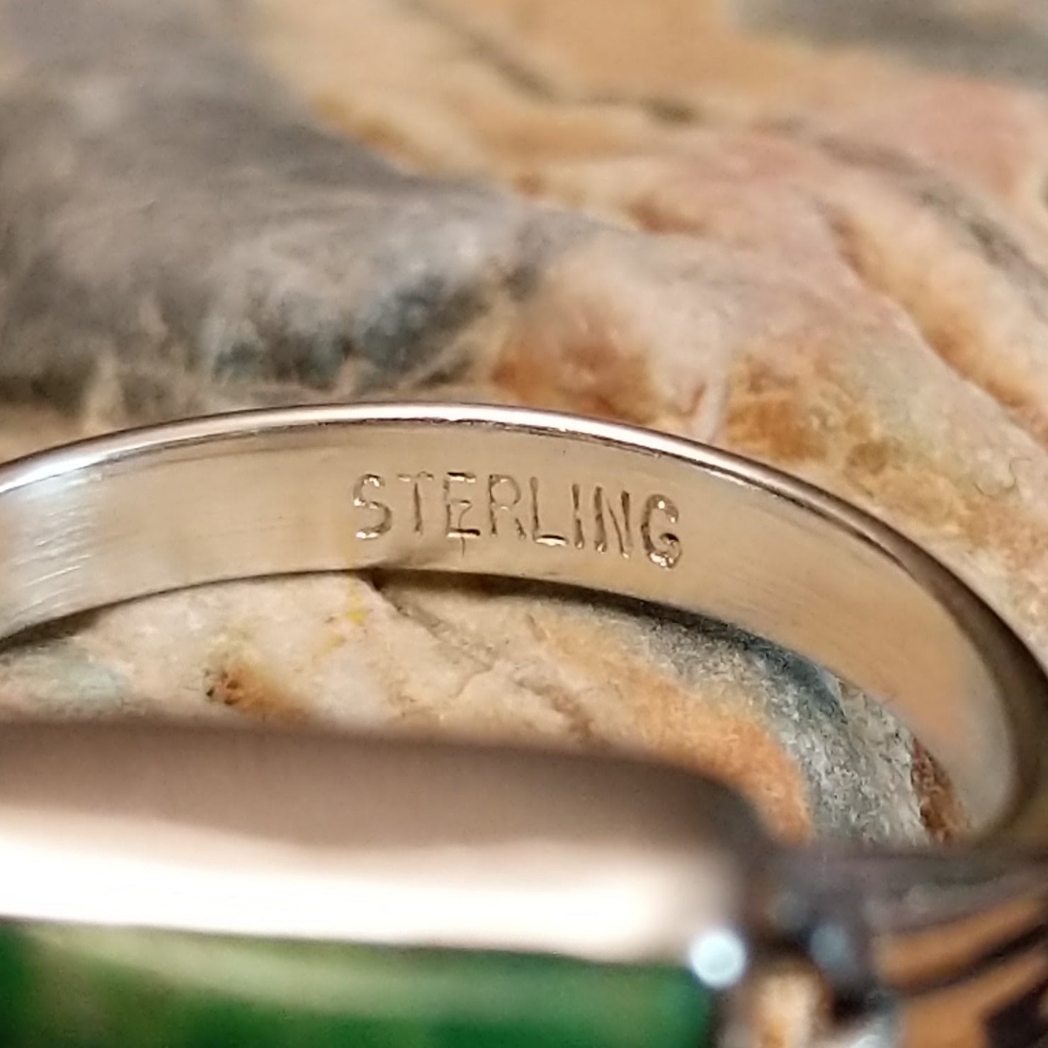 Close-up of the artisan's stamped signature.