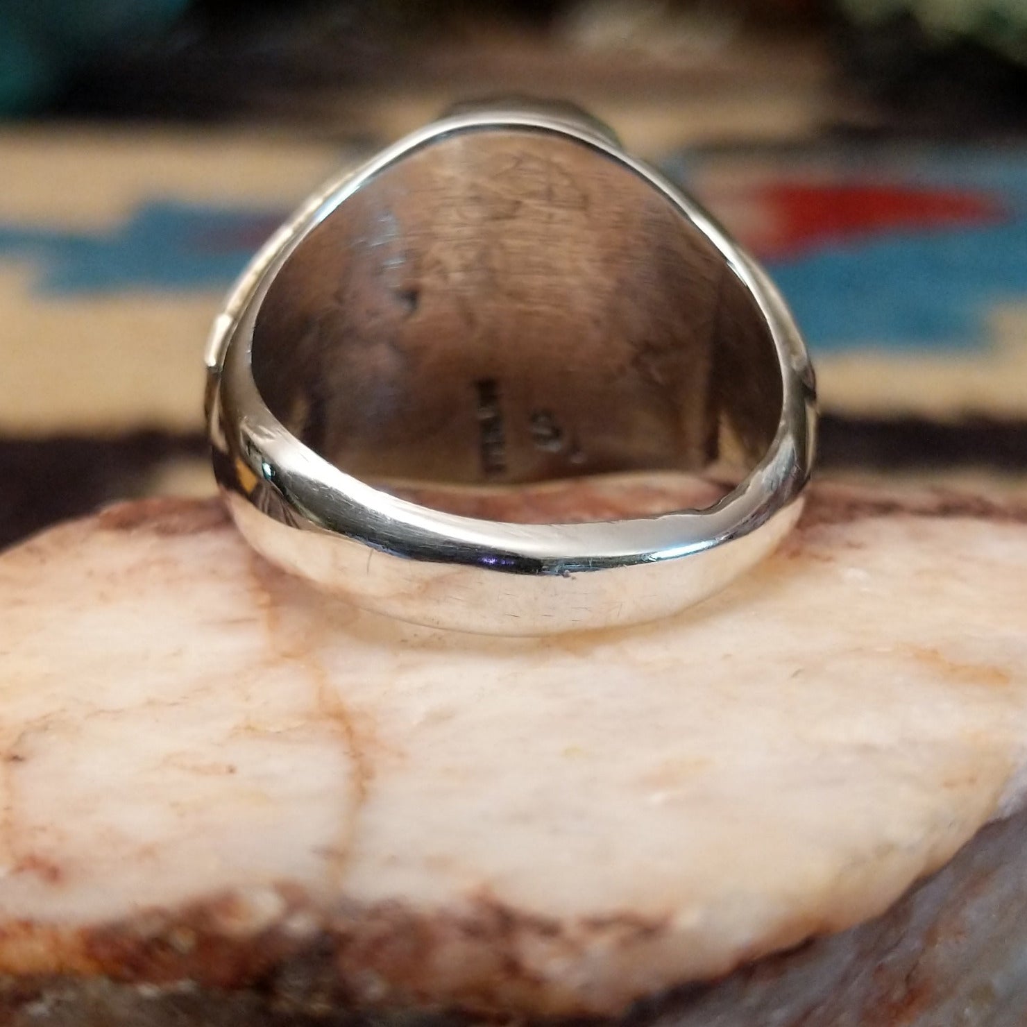 Sterling silver ring with dual turquoise set in scalloped bezels.