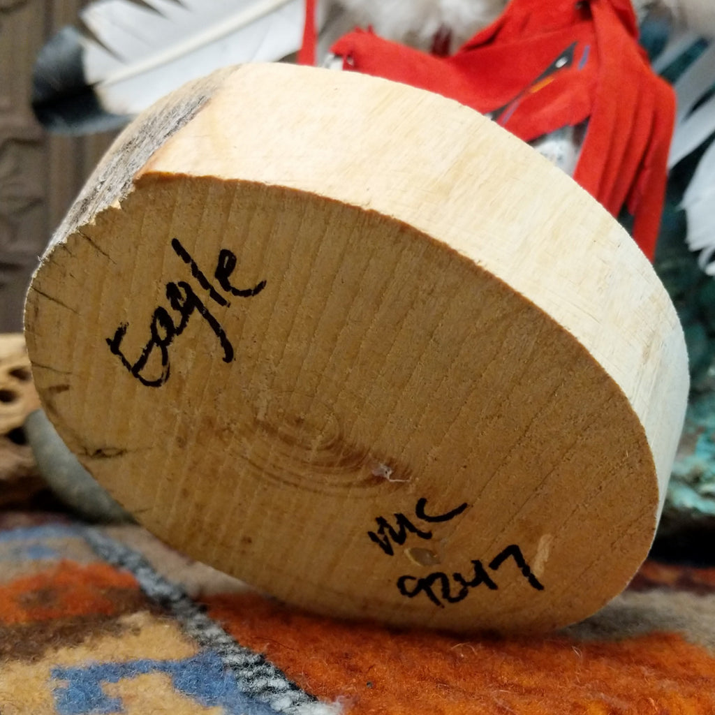 The title of the piece and artisan's initials are found on the underside of the piece.