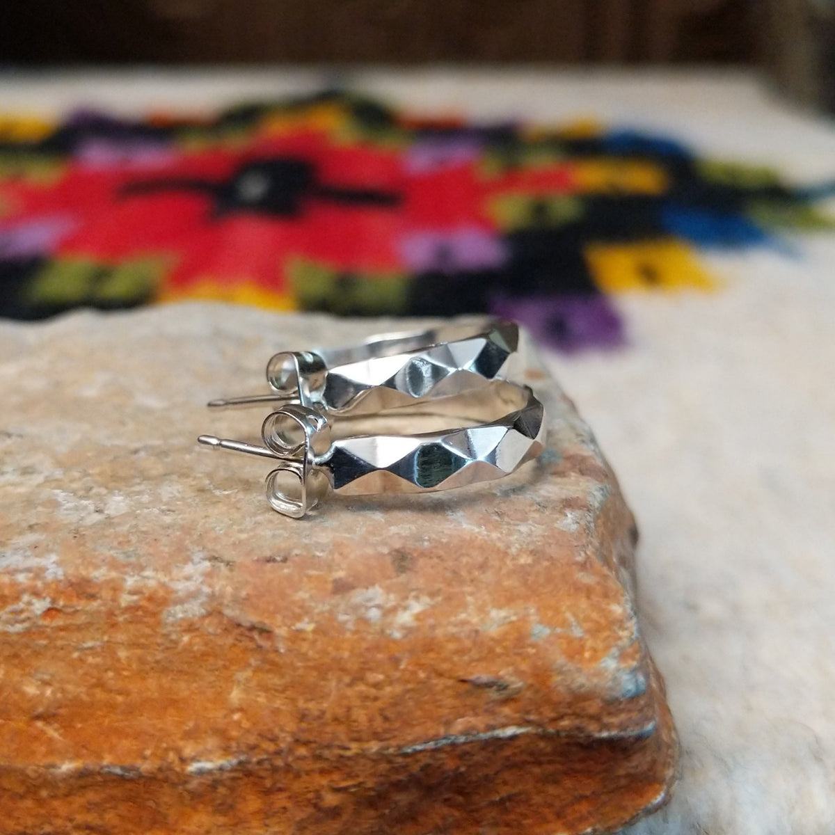 Navajo faceted silver hoop earrings.