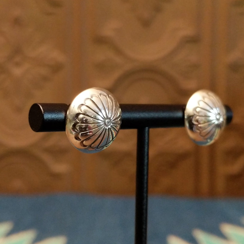 Dome earrings with floral accents.