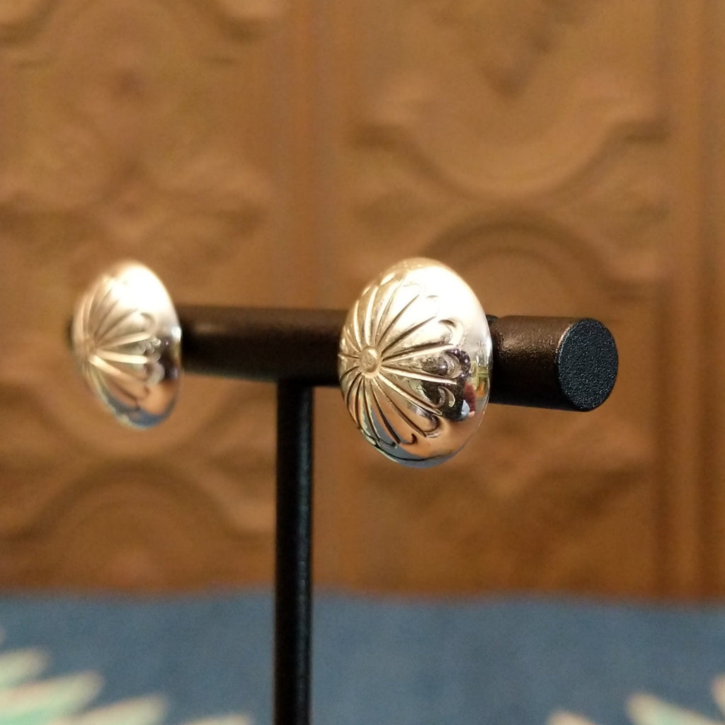 Dome earrings with floral accents.