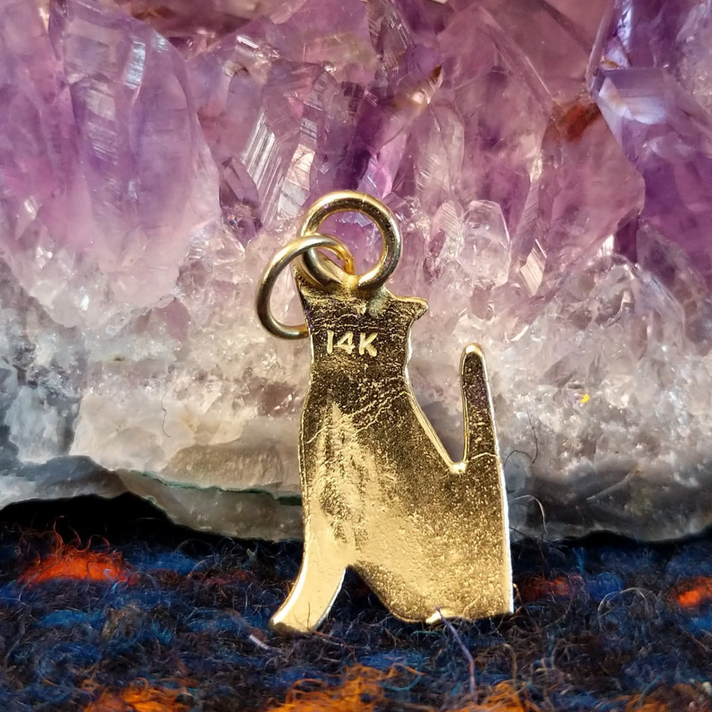 The gold authentication is found on the back of the pendant.