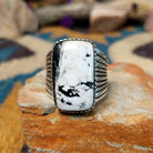 Sterling silver White Buffalo ring by J.P. featuring a rectangular White Buffalo stone with black veining, serrated bezel, and grooved split-shank Southwestern design.
