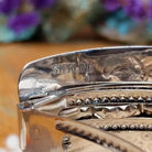 Close up of stamped Sterling, indicating sterling silver construction.