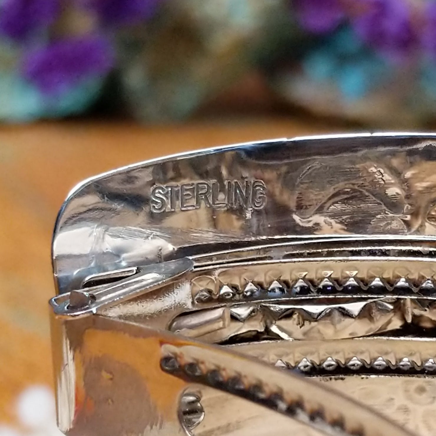 Close up of stamped Sterling, indicating sterling silver construction.