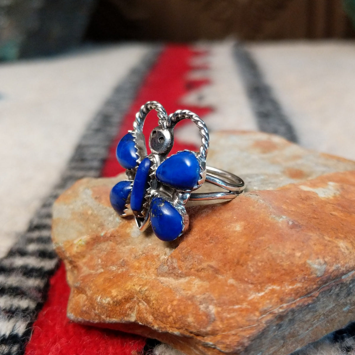 Navajo lapis butterfly ring by P.W. with twisted silver wire antennae.
