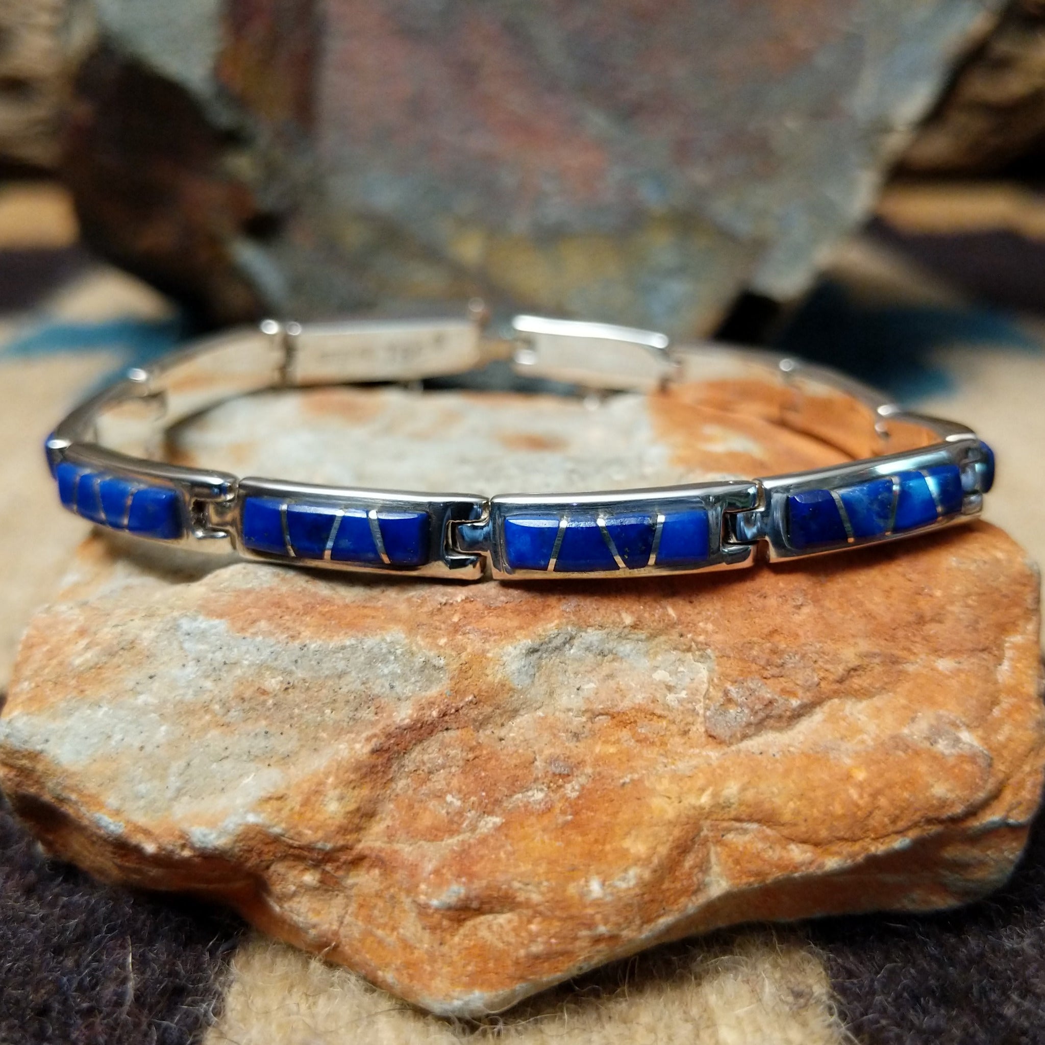 Navajo lapis inlay link bracelet with deep blue lapis set in handcrafted sterling silver.
