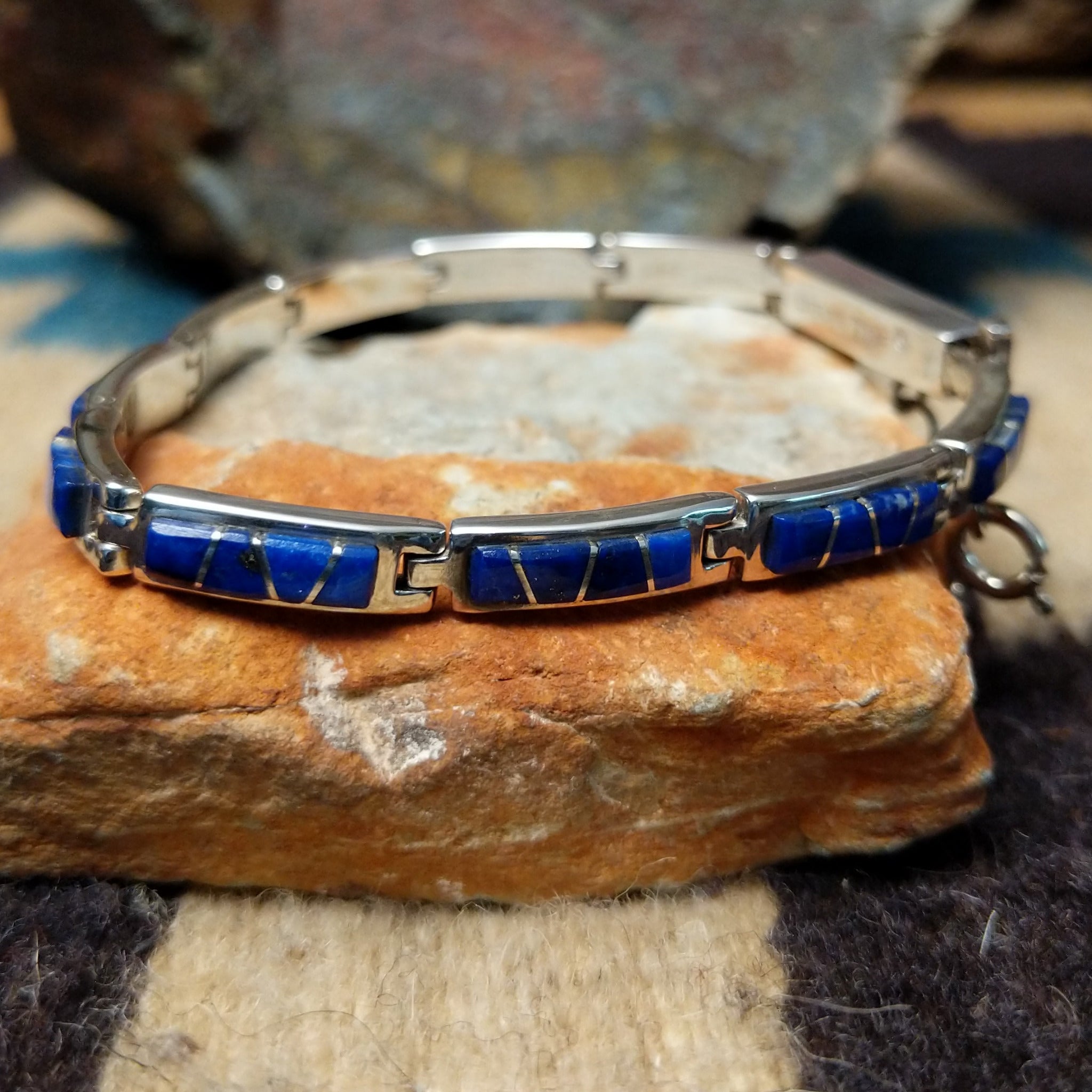 Navajo lapis inlay link bracelet with deep blue lapis set in handcrafted sterling silver.