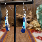 Flowing jewelry set with matching necklace, earrings, and cuff featuring lapis and manmade opal inlays.