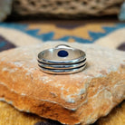 Handcrafted sterling silver Navajo lapis oval ring by D.C., featuring a rich blue oval lapis gemstone in a classic bezel setting; underside view.