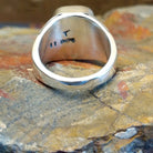 Sterling silver ring with lapis set in the rectangular bezel and geometric designs on the band.
