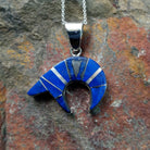 Handcrafted sterling silver lapis spirit bear pendant by T.G., featuring a traditional Navajo bear design.