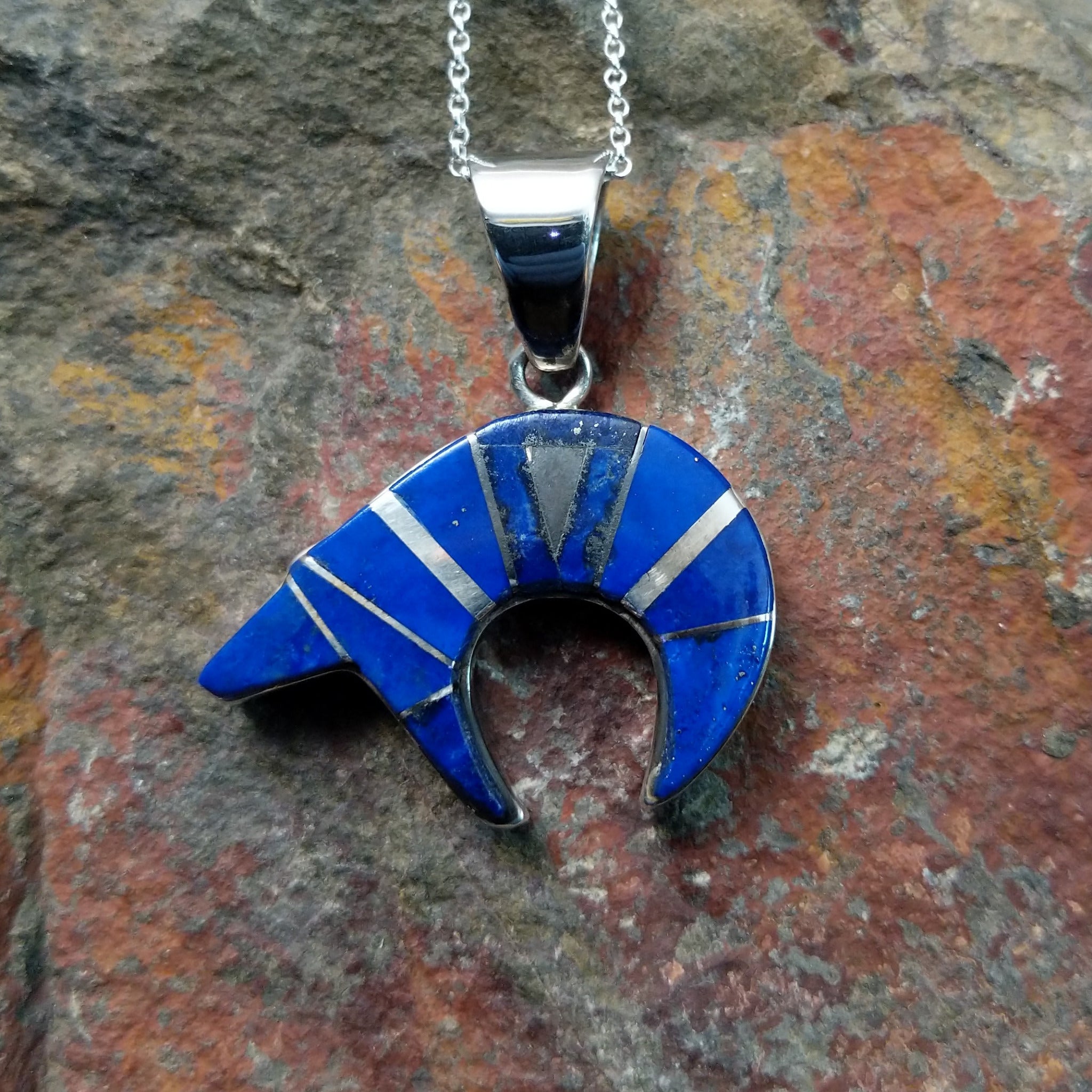 Handcrafted sterling silver lapis spirit bear pendant by T.G., featuring a traditional Navajo bear design.