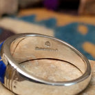 Sterling silver Navajo inlay ring with Lapis Lazuli, Turquoise, and geometric accents; artisan and Sterling Silver stamp.