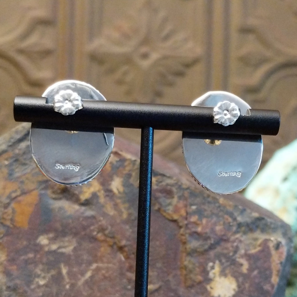 The back features the authentication stamp.