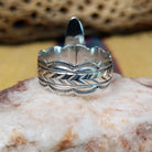 Navajo long black onyx ring, featuring an elongated black onyx stone set in a handcrafted sterling silver ring with an intricately detailed band.  Underside view.