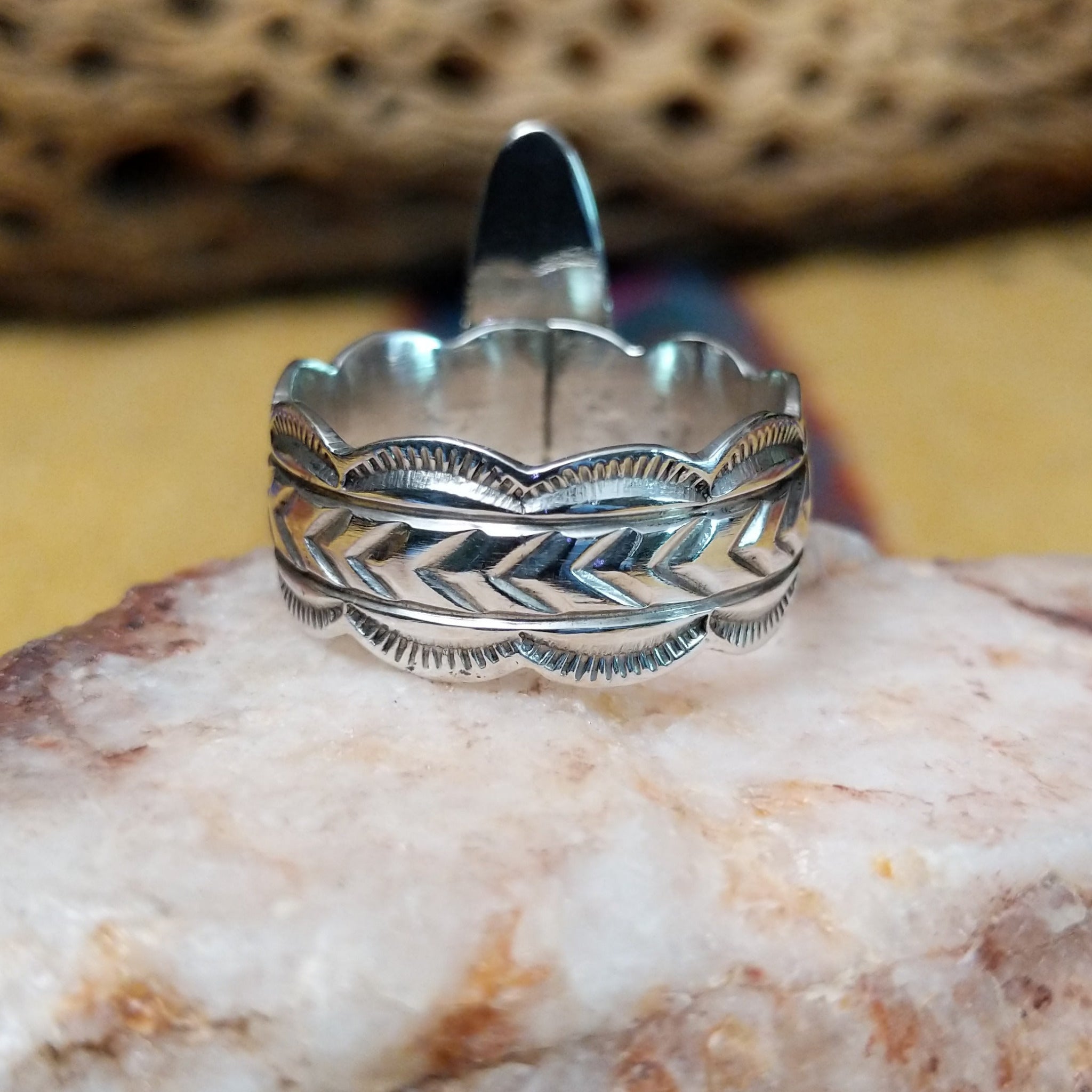 Navajo long black onyx ring, featuring an elongated black onyx stone set in a handcrafted sterling silver ring with an intricately detailed band.  Underside view.
