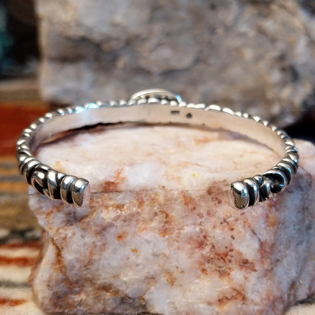 Intricate stamping on the band of the cuff.