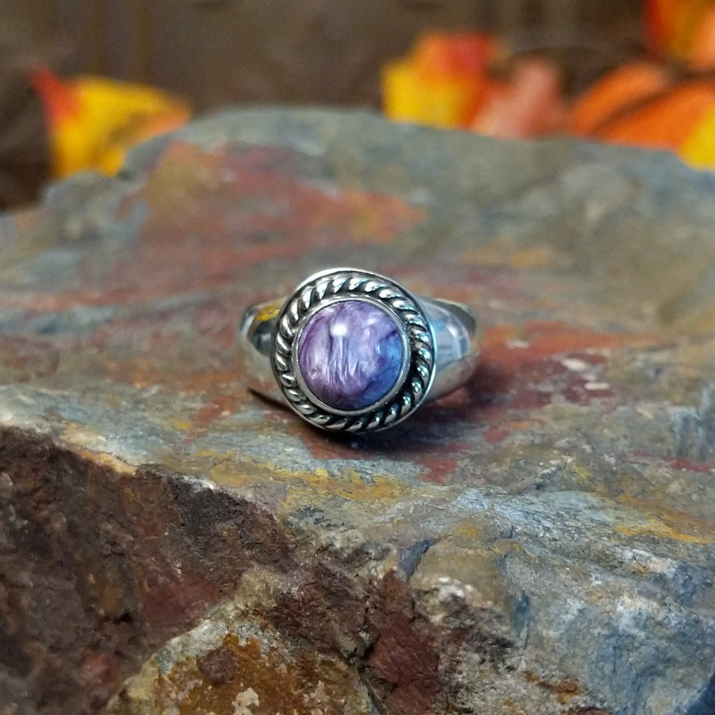Charoite set in sterling silver bezel with twisted rope accents creating the centerpiece of the ring.