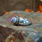 Charoite set in sterling silver bezel with twisted rope accents creating the centerpiece of the ring.