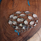 back side of coral and sterling silver concho belt