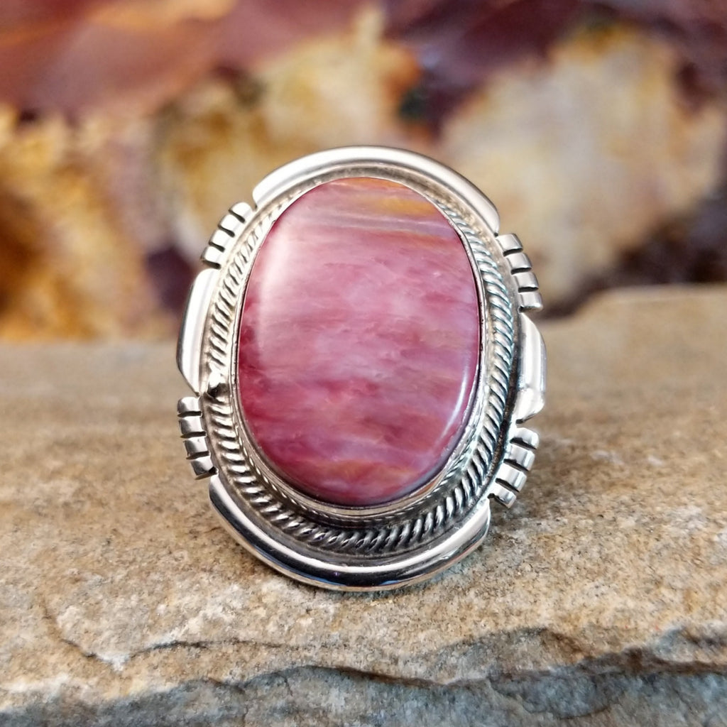 Intricate sterling silver setting with a light purple spiny oyster shell.