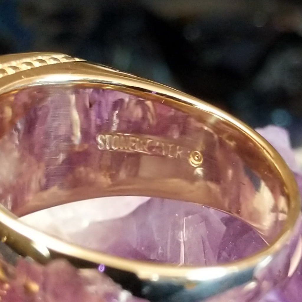 The maker's signature stamped into the band.