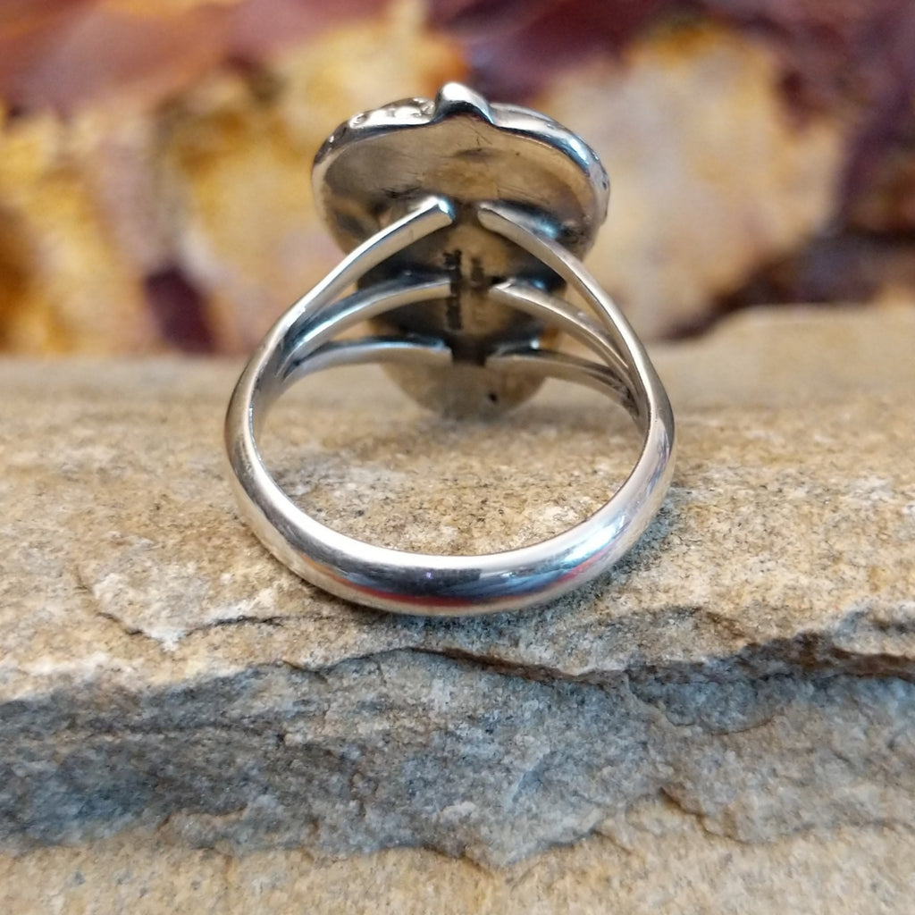 The band is thin and polished on the ring.