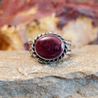 Purple spiny oyster shell set in a twisted rope bezel.