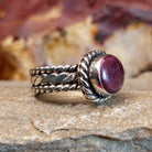 Purple spiny oyster shell set in a twisted rope bezel.