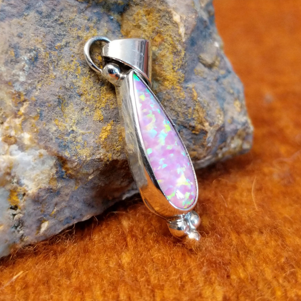 Pink manmade opalset in sterling silver with dotted accents.