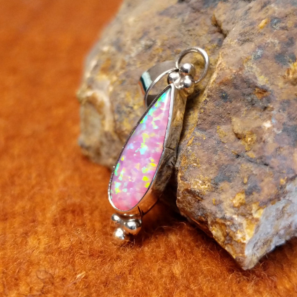 Pink manmade opalset in sterling silver with dotted accents.