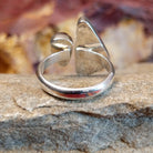 The thin band is polished sterling silver.